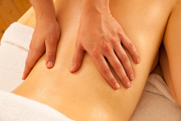 Body care. Spa body massage treatment. Woman having massage in t - Photo, Image