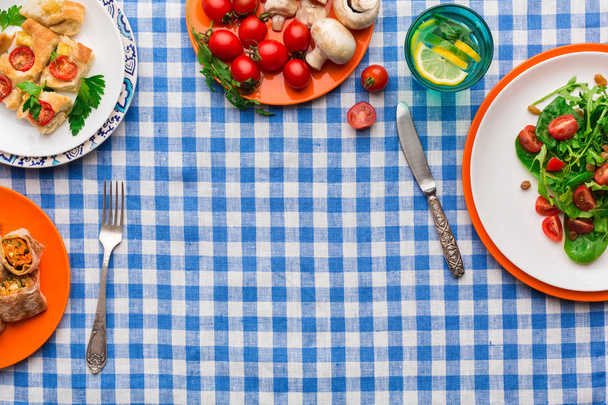 Eating healthy food on checkered tablecloth background, top view, copy space. - Fotoğraf, Görsel