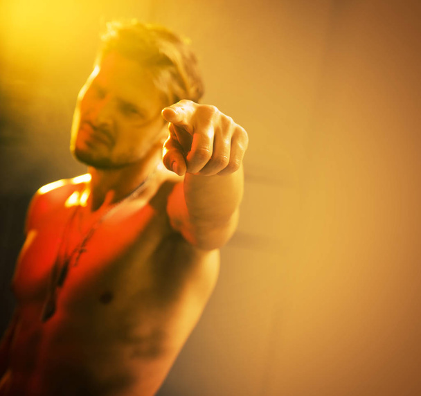 Blurred portrait of a handsome, muscular guy - Fotó, kép