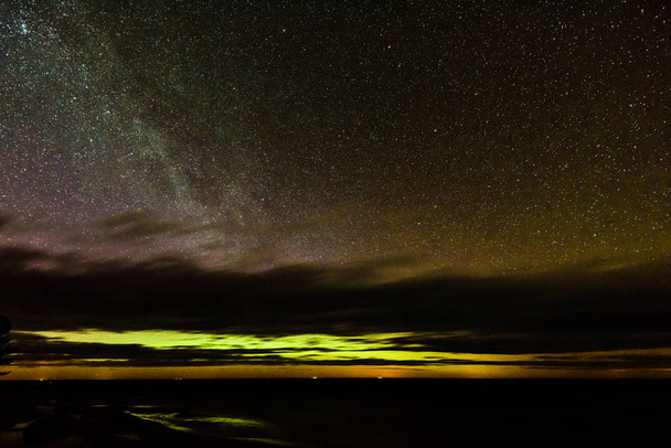 Intense northern lights (Aurora borealis) over Baltic sea - Photo, Image