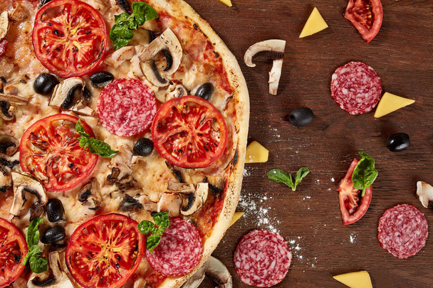 delicious italian pizza served on wooden table - Valokuva, kuva