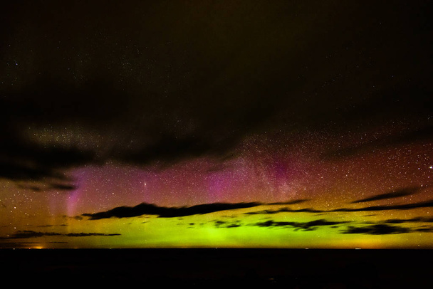 Intense northern lights (Aurora borealis) over Baltic sea - Photo, Image