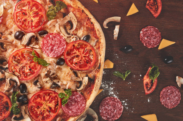 delicious italian pizza served on wooden table - Φωτογραφία, εικόνα