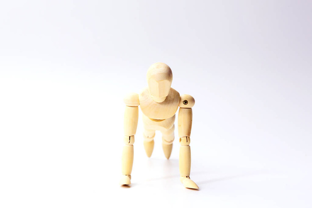Wooden figure doll with push up emotion for sport exercise conce - Φωτογραφία, εικόνα