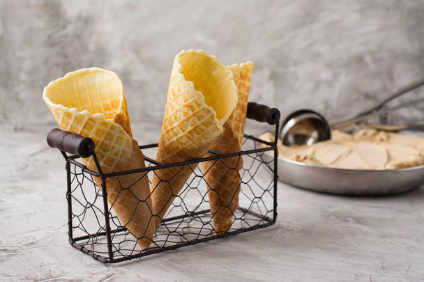 waffle cones on stone table - Foto, afbeelding