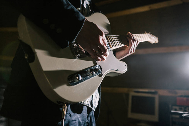 Playing electric guitar in studio closeup - Φωτογραφία, εικόνα