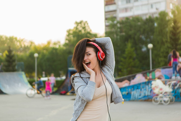 Girl listening to music streaming with headphones. - Foto, Bild