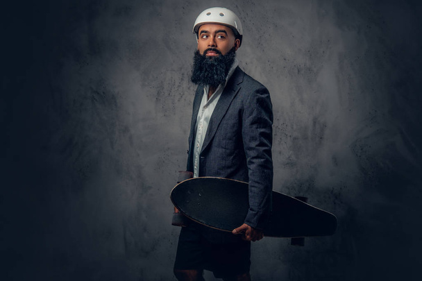 Arabic male holds long board - Photo, Image