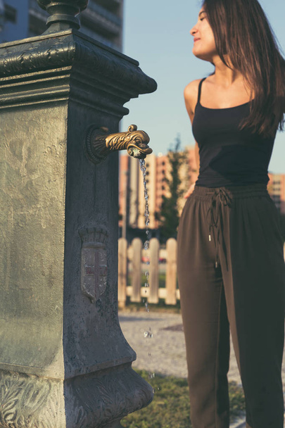Young woman posing in an urban context - Fotó, kép