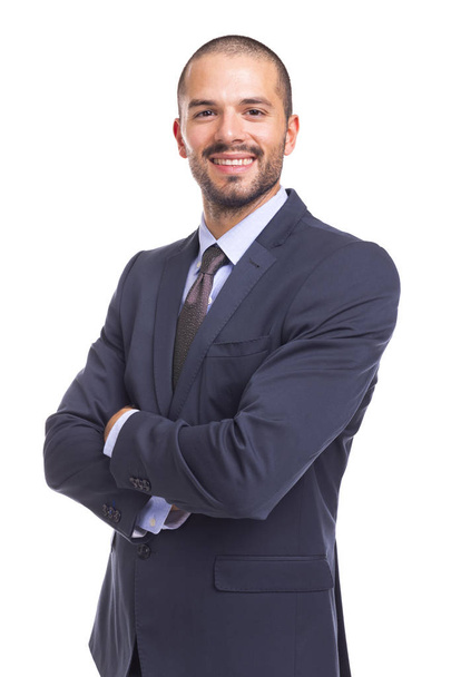 handsome smiling businessman with arms crossed - Fotó, kép