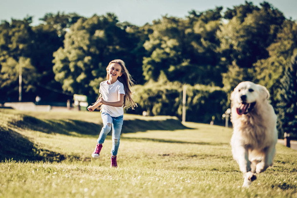 Little cute girl with dog - Photo, Image