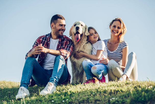 Happy family with dog - Фото, изображение