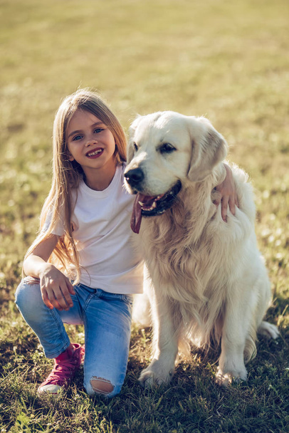 Little cute girl with dog - Photo, image