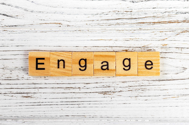 ENGAGE word made with wooden blocks concept - Photo, Image