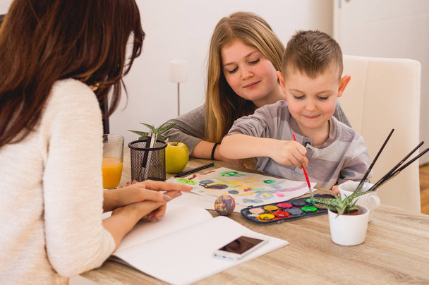 Happy family painting at home - Фото, изображение