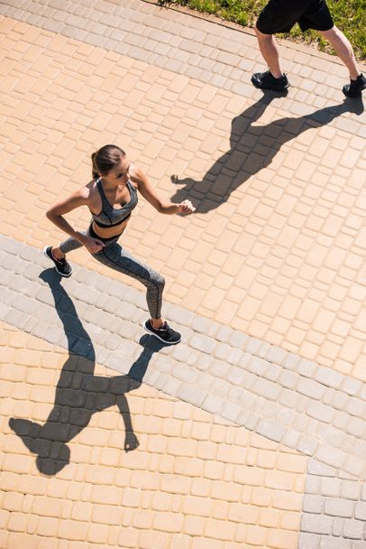 woman jogging on street - Фото, изображение