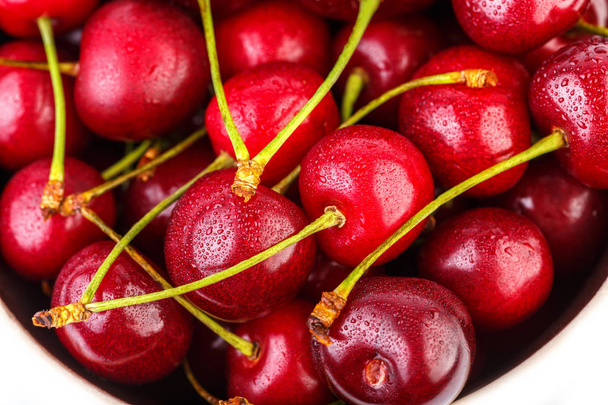 Cherries background. Isolated cherries. Cherry fruits isolated on white background with clipping path. Sweet cherry isolated on white - Foto, afbeelding