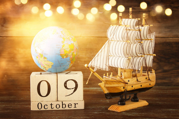 Columbus day concept with old ship over wooden background - Photo, Image