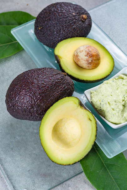 Avocado skin & hair care home spa, ripe avocados and bowl with h - Photo, Image