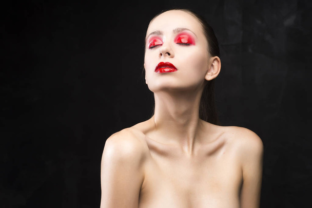 girl with the red eyeshadow covered with gloss - Foto, immagini