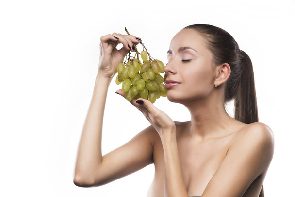 girl beauty portrait with a green grapes isolated on a white - Foto, immagini
