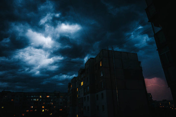Beautiful storm sky with clouds over the city, apocalypse like - Photo, Image