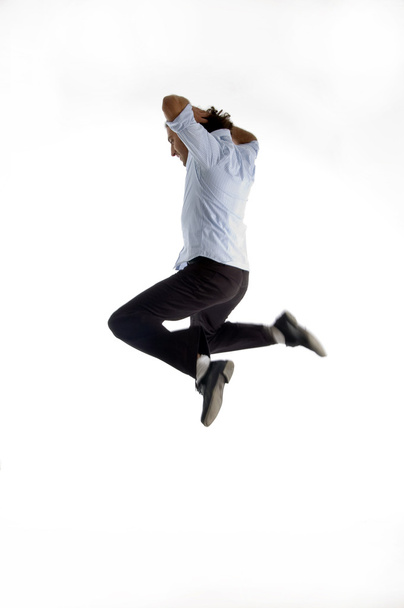 Handsome model jumping high in air - Foto, imagen