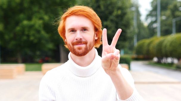 Victory Sign by Man with Red Hairs, Outdoor - Foto, immagini