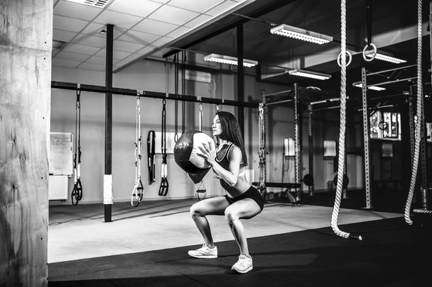 Woman training with functional gymnastic in the gym - Фото, зображення