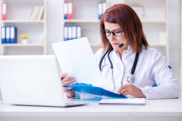 Woman doctor in telemedicine concept - Photo, Image
