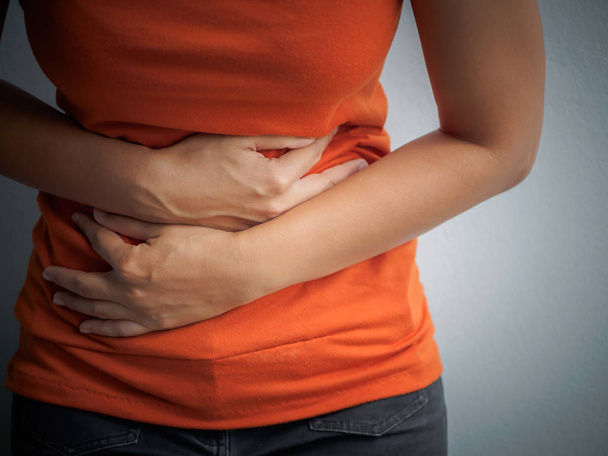Young woman having painful stomachache. Chronic gastritis.  - Photo, Image