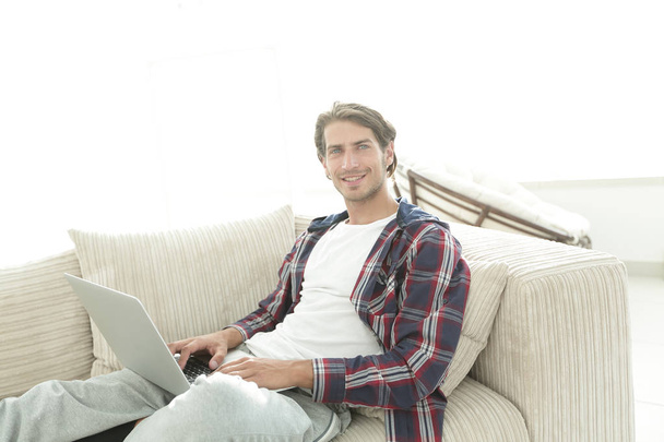 serious young man with laptop. - Fotografie, Obrázek