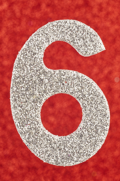 Number six silver color over a red background. Anniversary.  - Photo, Image