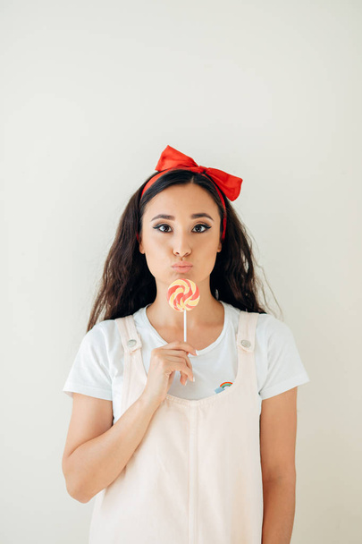 Beautiful sexy woman model with pink lips and lollipop on white background - Zdjęcie, obraz