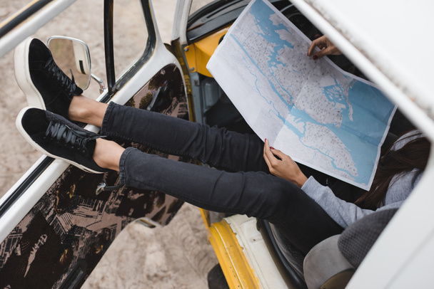 traveler with map in minivan - Photo, image