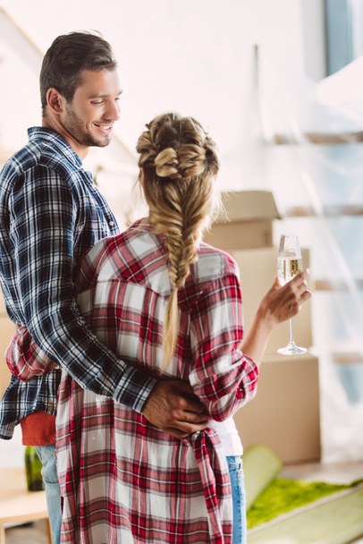 couple drinking champagne in new house - Photo, Image