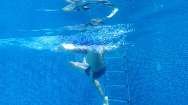 children swim under water. 4k. Slow motion - Footage, Video