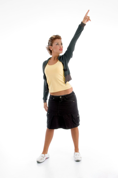 Attractive woman pointing upwards - Photo, Image