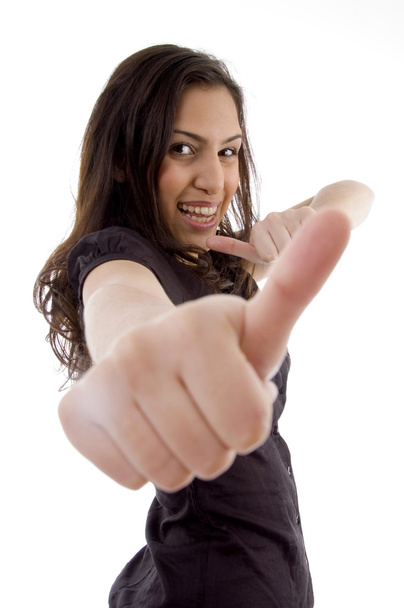 Smiling young woman showing thumbs up - Φωτογραφία, εικόνα