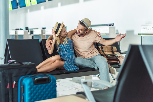 couple waiting for boarding at airport - Photo, Image