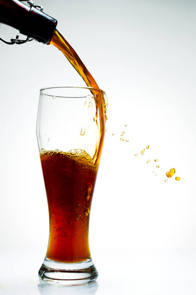 Beer is pouring from a bottle - Photo, Image