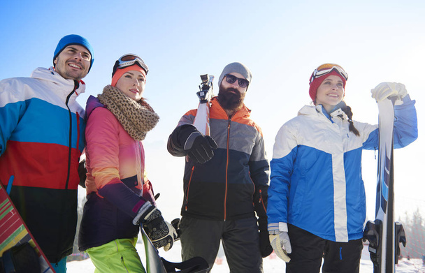 Happy mates with snowboards and ski - Photo, Image
