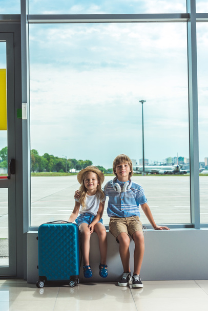 siblings waiting in airport - Photo, image
