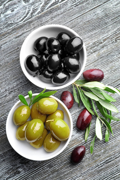 Bowls with tasty olives  - 写真・画像