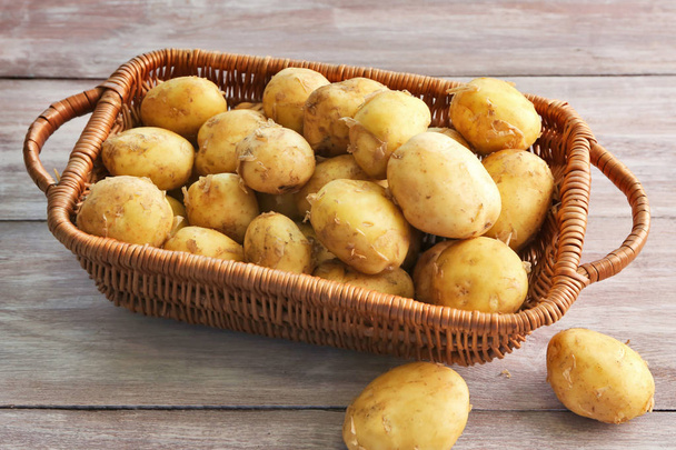 Wicker basket with young potatoes  - Fotoğraf, Görsel