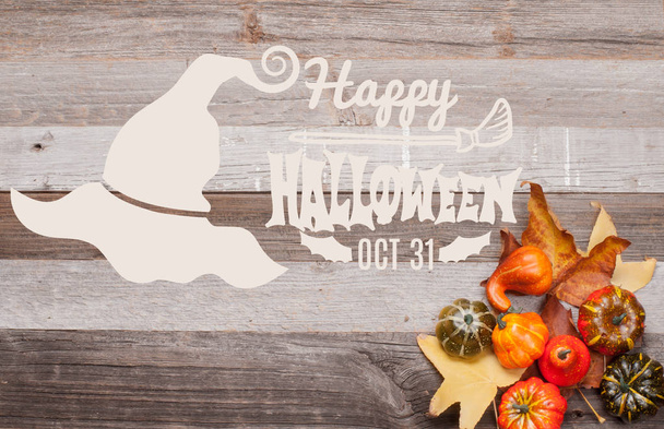 Pumpkins and fall leaves on wooden background. Halloween. Autumn concept - Foto, Imagen