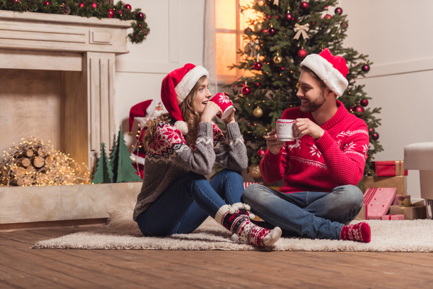 couple with cups at christmastime - Photo, image