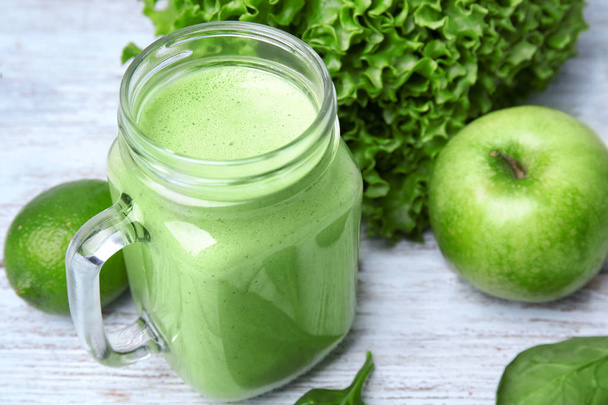 Mason jar of green healthy juice   - Fotó, kép