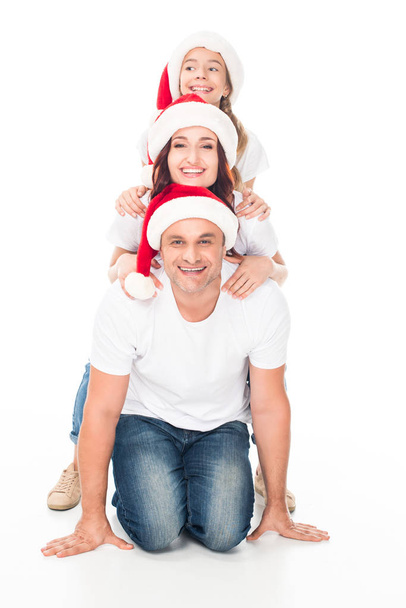 Happy family in Santa hats - Fotografie, Obrázek