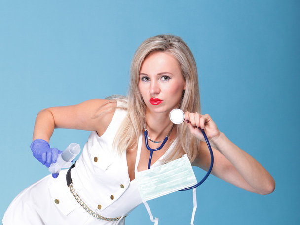 Sexual woman in nurse suit with stethoscope blue - Fotografie, Obrázek